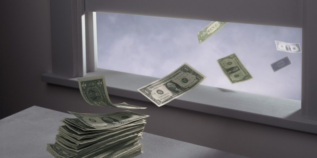 money-flying-out-of-window